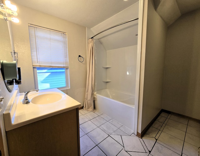 bathroom with tile patterned floors, vanity, shower / bath combination with curtain, and lofted ceiling