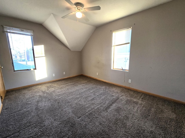 bonus room featuring carpet flooring, vaulted ceiling, a wealth of natural light, and ceiling fan