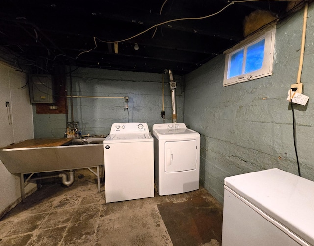 laundry area with washer and dryer and sink