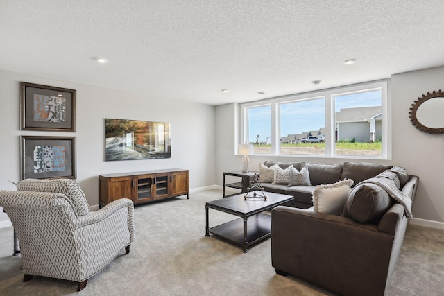 living room featuring light carpet and a textured ceiling