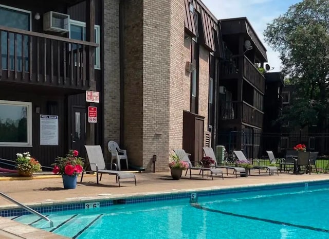 view of swimming pool with a patio area