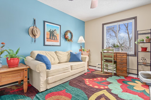 carpeted living room featuring ceiling fan and a textured ceiling