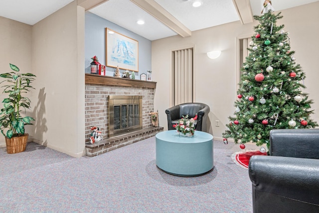 living room featuring beamed ceiling, carpet floors, and a fireplace