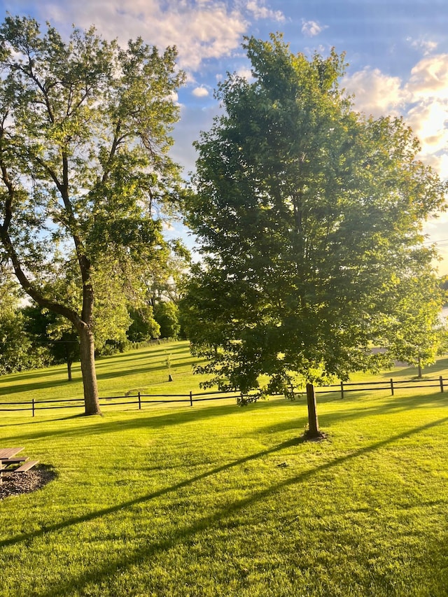 view of property's community with a lawn