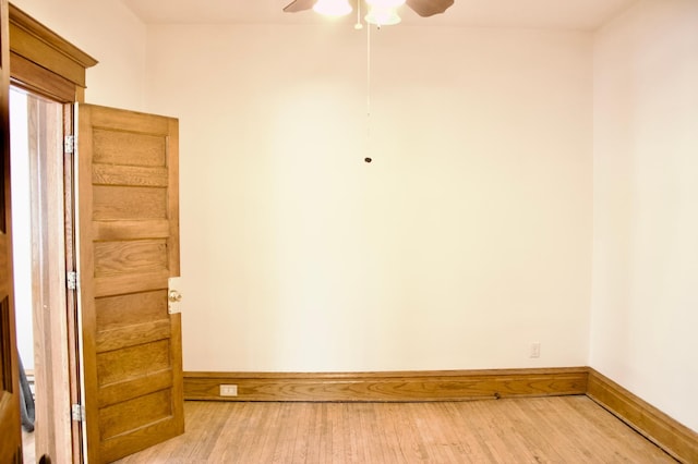 spare room featuring ceiling fan and hardwood / wood-style flooring