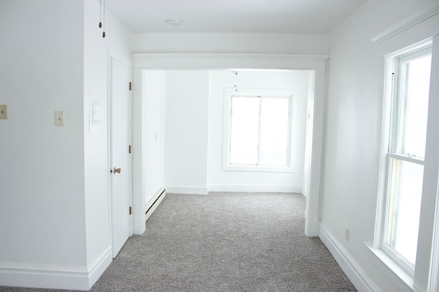 hall with carpet and a baseboard radiator