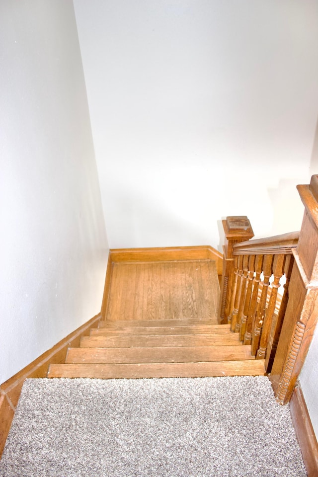 stairs featuring carpet