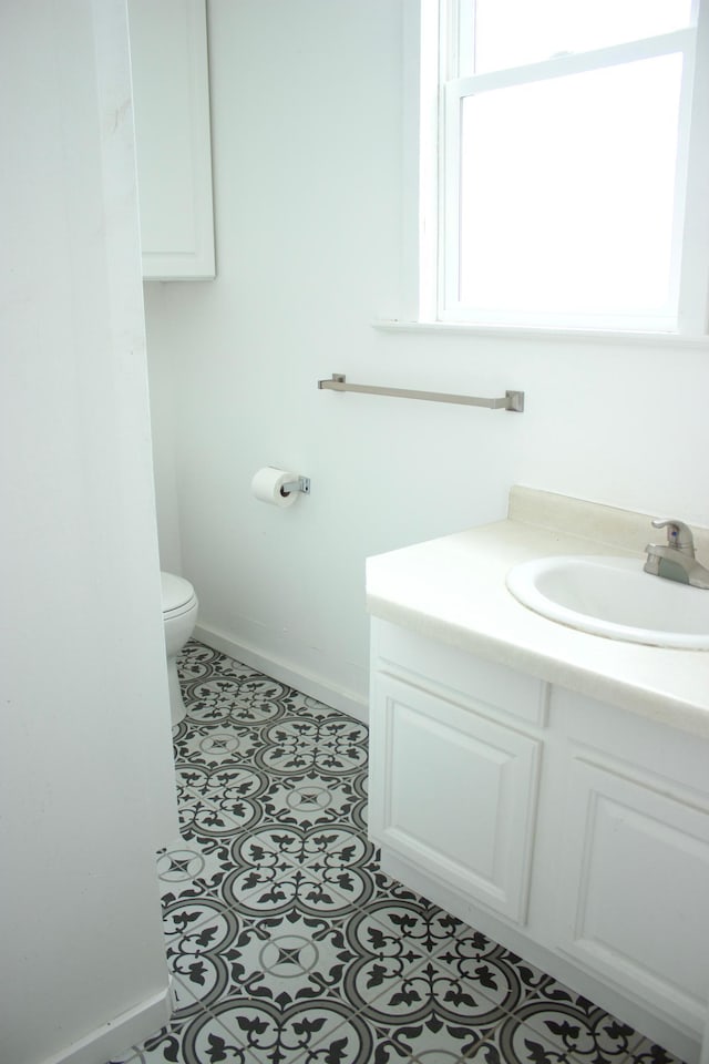 bathroom with vanity and toilet