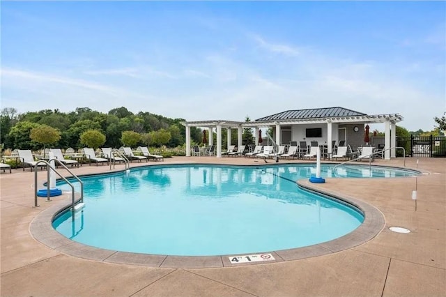 view of swimming pool with a patio and a pergola