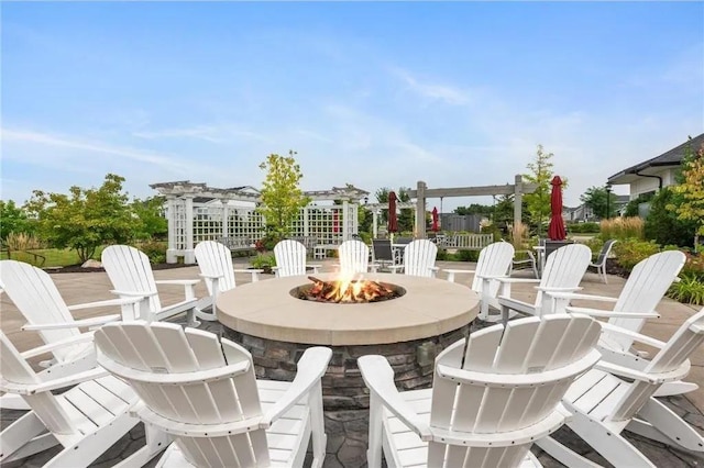 view of patio with a fire pit