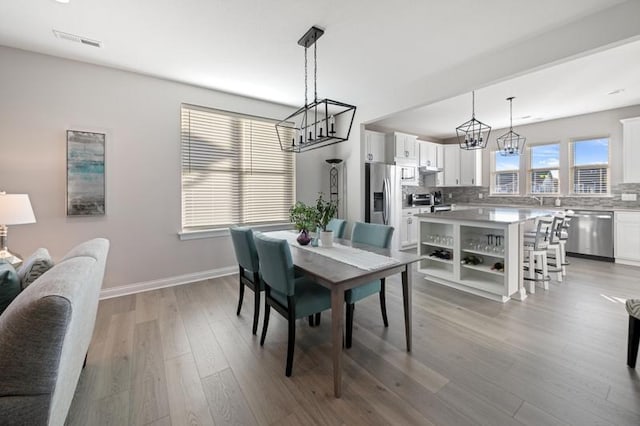 dining room with hardwood / wood-style floors