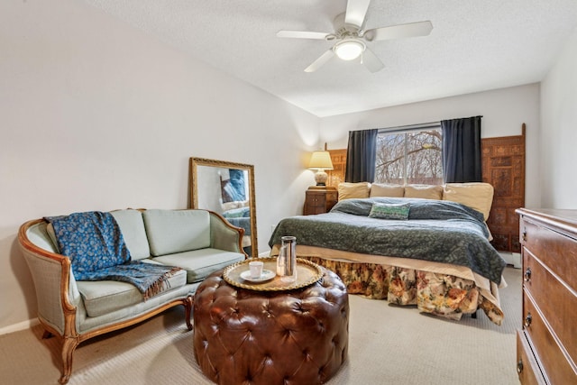 carpeted bedroom featuring ceiling fan, a textured ceiling, and a baseboard radiator