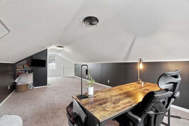 office space with a textured ceiling, carpet floors, and lofted ceiling