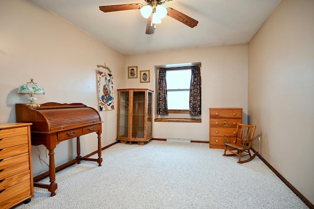 sitting room featuring light carpet and ceiling fan