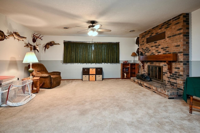 sitting room with carpet, a textured ceiling, and a brick fireplace