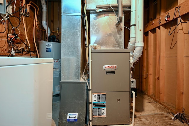 utility room with water heater