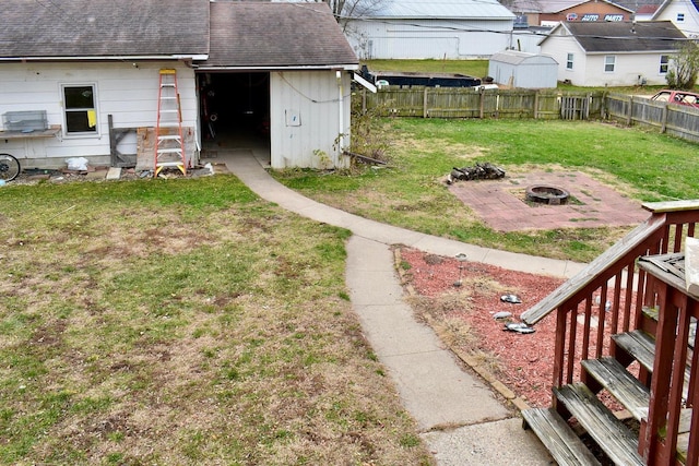 view of yard with a fire pit