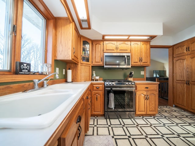 kitchen featuring electric stove and sink