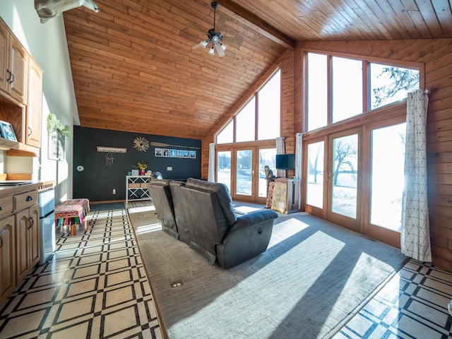 living room featuring beam ceiling, ceiling fan, french doors, high vaulted ceiling, and wood ceiling