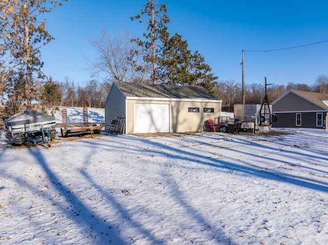 view of snow covered garage