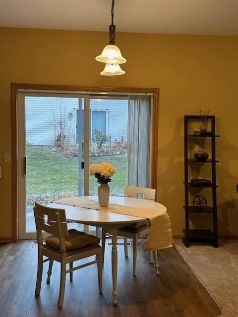 dining area with hardwood / wood-style flooring