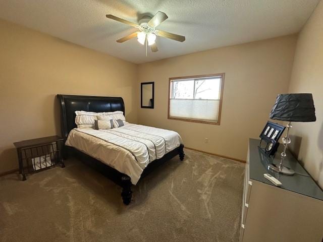 carpeted bedroom featuring a textured ceiling and ceiling fan