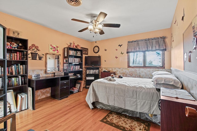 bedroom with ceiling fan and light wood-type flooring