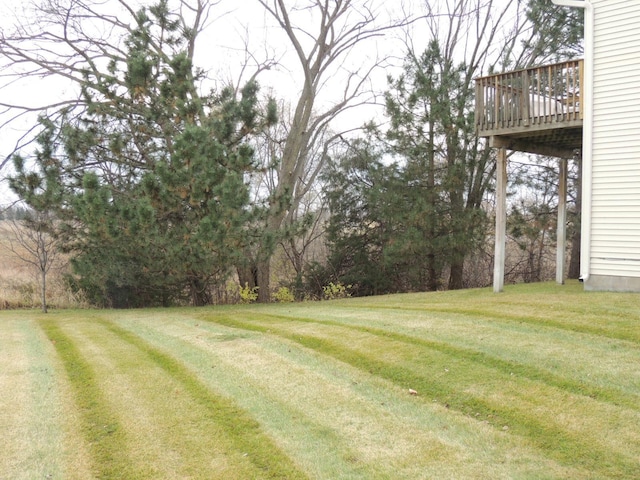 view of yard with a wooden deck