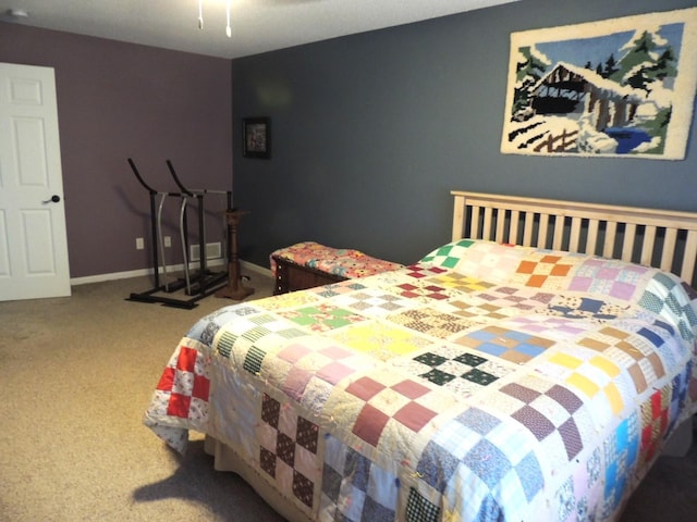 bedroom featuring carpet floors, a ceiling fan, and baseboards