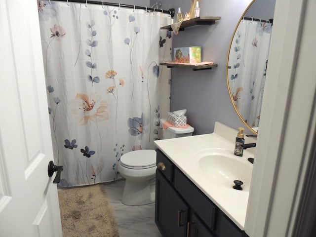 full bathroom featuring vanity and toilet