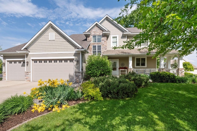 craftsman-style house with a porch, a front lawn, and a garage