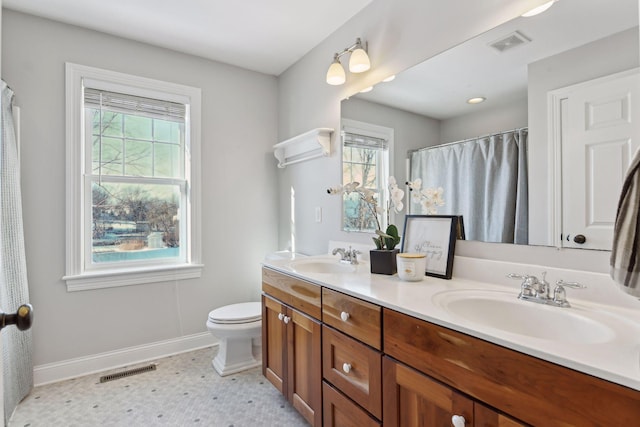 bathroom with vanity and toilet