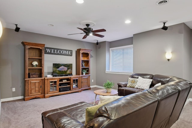 living room with ceiling fan and light carpet