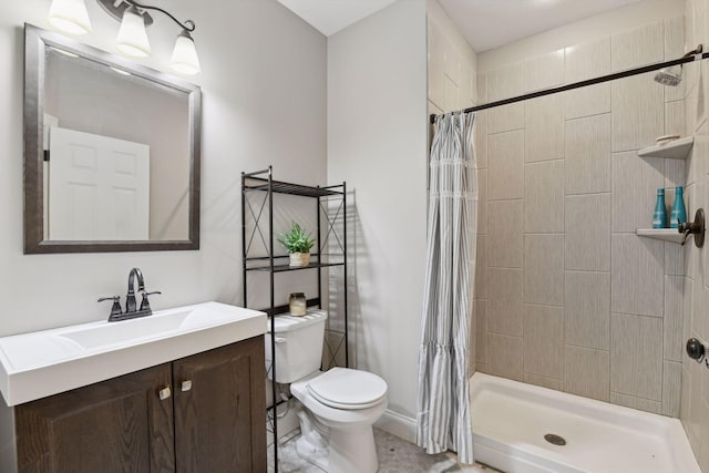 bathroom featuring toilet, a shower with shower curtain, and vanity