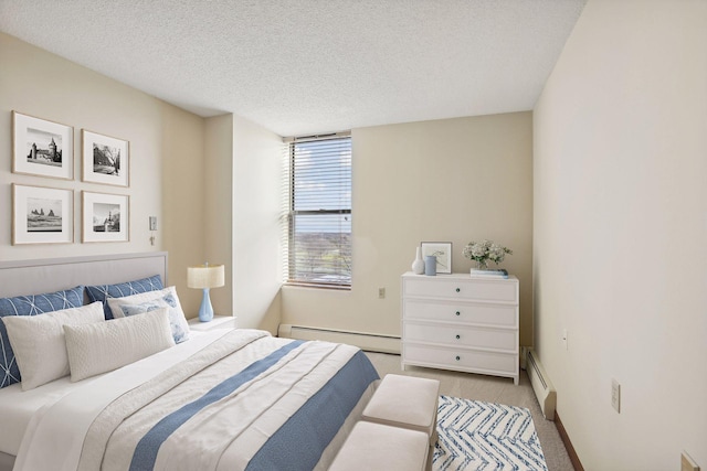 bedroom with light carpet, a baseboard radiator, baseboards, and a textured ceiling