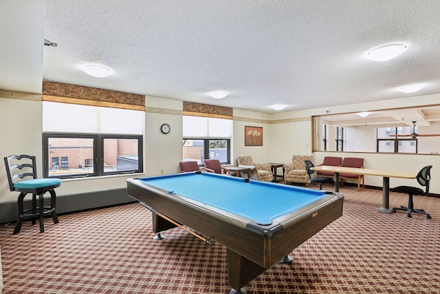 game room featuring carpet, pool table, a textured ceiling, and baseboards