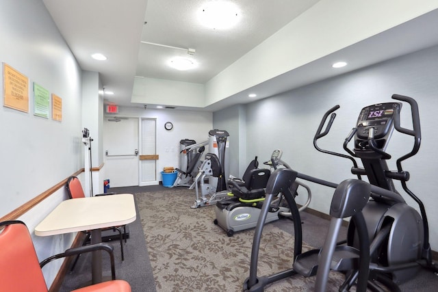 workout room featuring carpet and recessed lighting