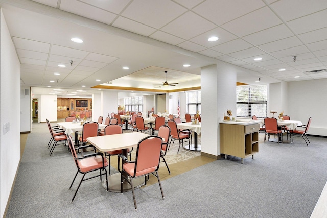 carpeted dining room featuring baseboards, visible vents, and recessed lighting