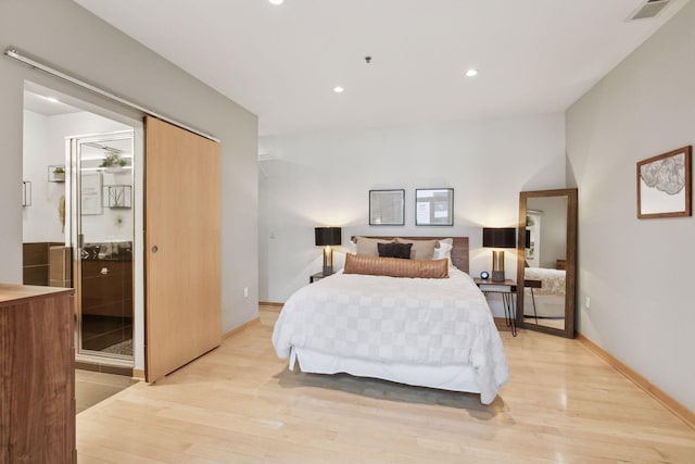 bedroom with light hardwood / wood-style flooring