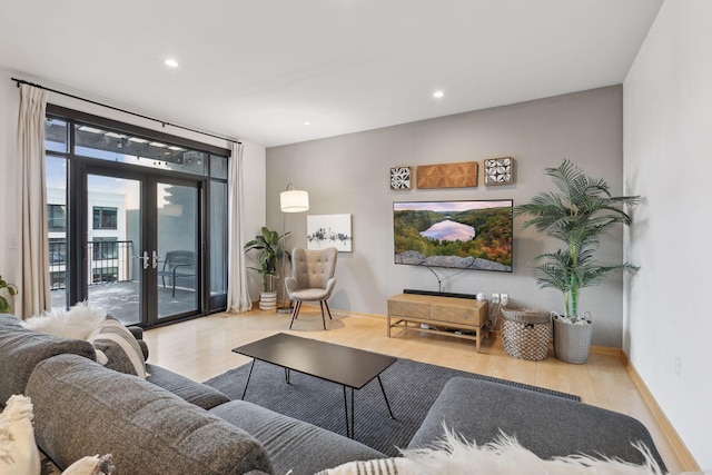 living room featuring french doors and light hardwood / wood-style floors