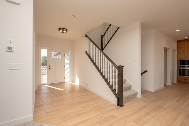 25341 Delmar Ave, New Prague, MN 56071 - entrance foyer featuring light wood-style floors, baseboards, stairs, and recessed lighting