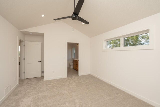 25341 Delmar Ave, New Prague, MN 56071 - unfurnished bedroom with lofted ceiling, light colored carpet, baseboards, recessed lighting, and ensuite bathroom