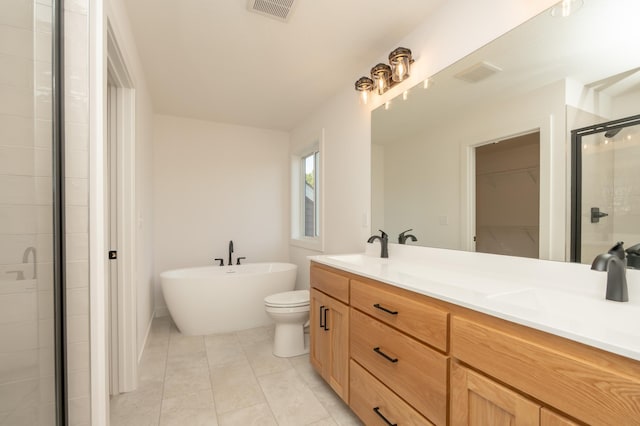 25341 Delmar Ave, New Prague, MN 56071 - bathroom featuring a shower stall, double vanity, a spacious closet, a freestanding tub, and tile patterned flooring