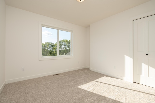 25341 Delmar Ave, New Prague, MN 56071 - unfurnished bedroom featuring carpet flooring, a closet, and baseboards