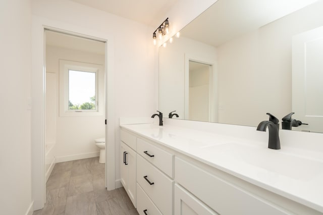 25341 Delmar Ave, New Prague, MN 56071 - full bath with double vanity, toilet, and a tub