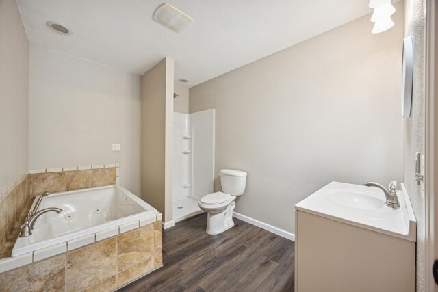 full bathroom featuring plus walk in shower, hardwood / wood-style floors, vanity, and toilet