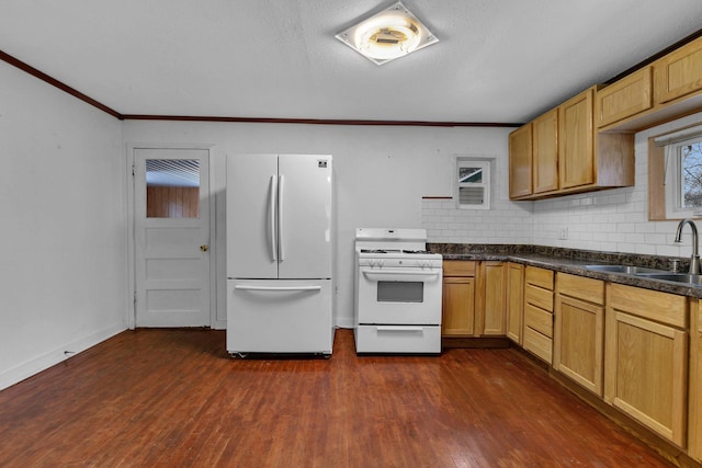 kitchen featuring dark hardwood / wood-style flooring, tasteful backsplash, white appliances, crown molding, and sink