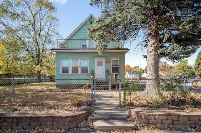 view of front of house featuring a balcony