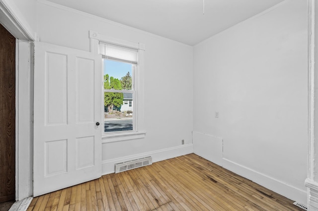 unfurnished room featuring light hardwood / wood-style flooring