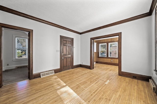 entrance foyer featuring plenty of natural light and light hardwood / wood-style flooring